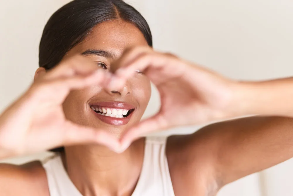 A patient smiling during a cosmetic dentistry consultation